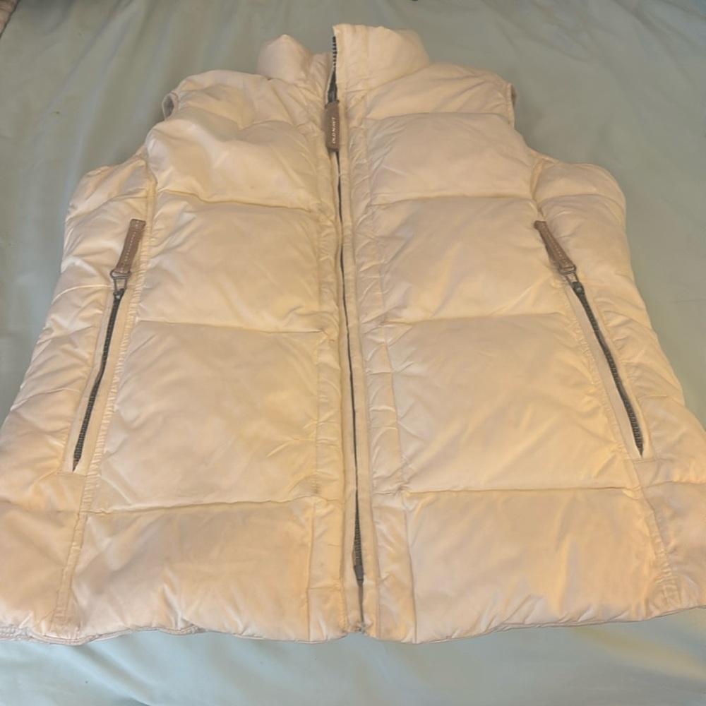 Woman’s size S off white puffer vest.